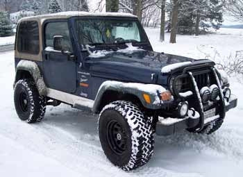2000 Wrangler Sport with 2" coil spacers and 1" body lift