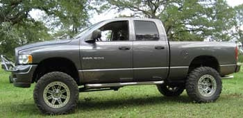 2003 Dodge Ram 1500 with 5" suspension lift kit and 3" body lift