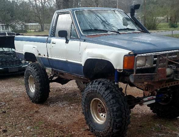 1984 Toyota pickup with a 7" Skyjacker suspension lift kit, 3" body lift