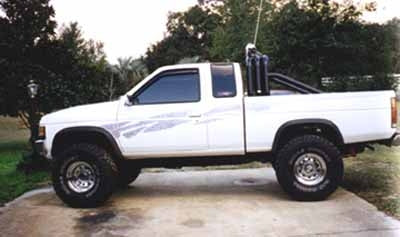 1995 Nissan King Cab 4WD with 3" Superlift suspension lift kit, 2" body lift