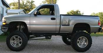 2002 Chevy K1500 Silverado with 12" lift kit, 3" body lift