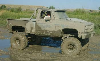 1982 Chevy short box with 12" suspension lift kit and 3" body lift