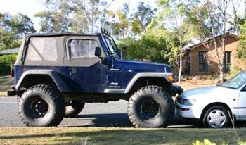 2003 TJ Wrangler with 6" Rough Country Short Arm lift kit, 2" of Body Lift