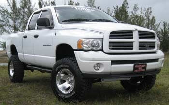 2002 Dodge Ram 1500 4x4 with 2" leveling kit, 3" blocks in rear, 3" body lift