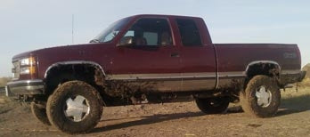 1999 GMC Sierra K1500 with Rough Country 2" leveling kit, 3" body lift