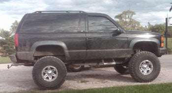 1999 Chevy Tahoe with 6" Rough Country suspension lift kit, 3" body lift, 3" torsion keys