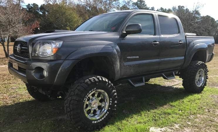 2011 4WD Toyota Tacoma with Fabtech 6" Performance lift kit, a 3" Performance Accessories body lift