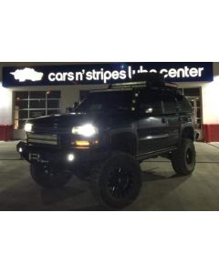 2006 Chevy Tahoe with a Fabtech 6” suspension lift kit, 3” body lift and 2” leveling kit