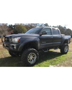 2011 4WD Toyota Tacoma with Fabtech 6" Performance lift kit, a 3" Performance Accessories body lift 